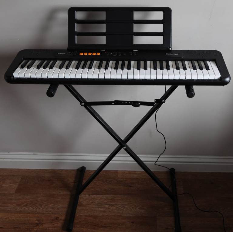 Casio CT-S100 electronic keyboard, adjustable stand, mains adaptor, instruction leaflet