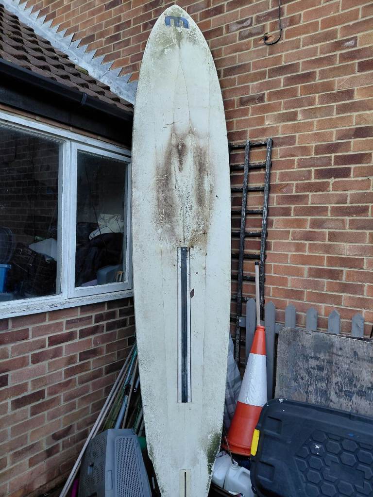 Old windsurfing board and sail 