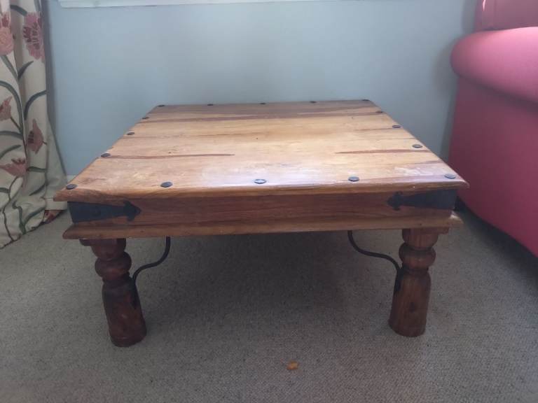 Solid Wood Coffee Table with Metal Accents – Good Condition