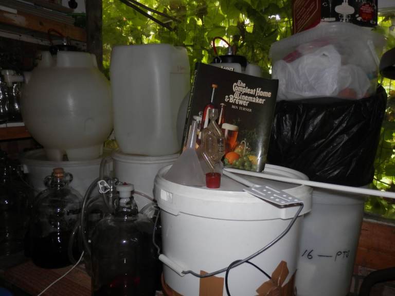 Lots of demijohns and home brew equipment