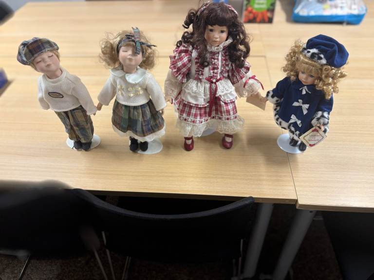 Set of 4 Porcelain Dolls with Fabric Clothes – Good Condition