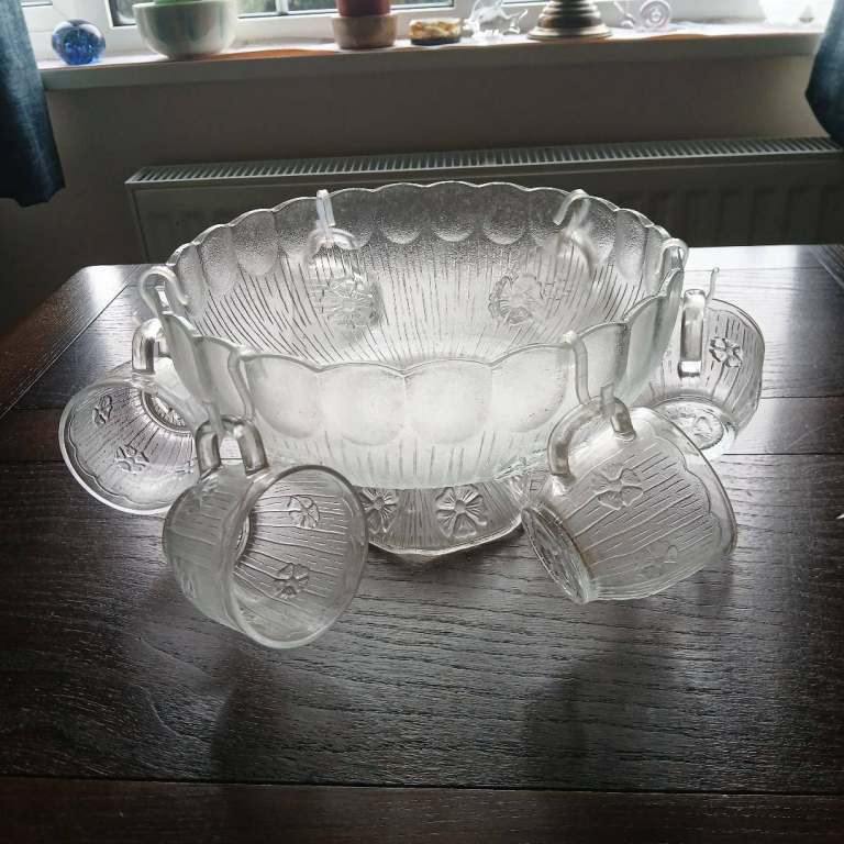 Beautiful glass punch bowl with six cups and ladle. 