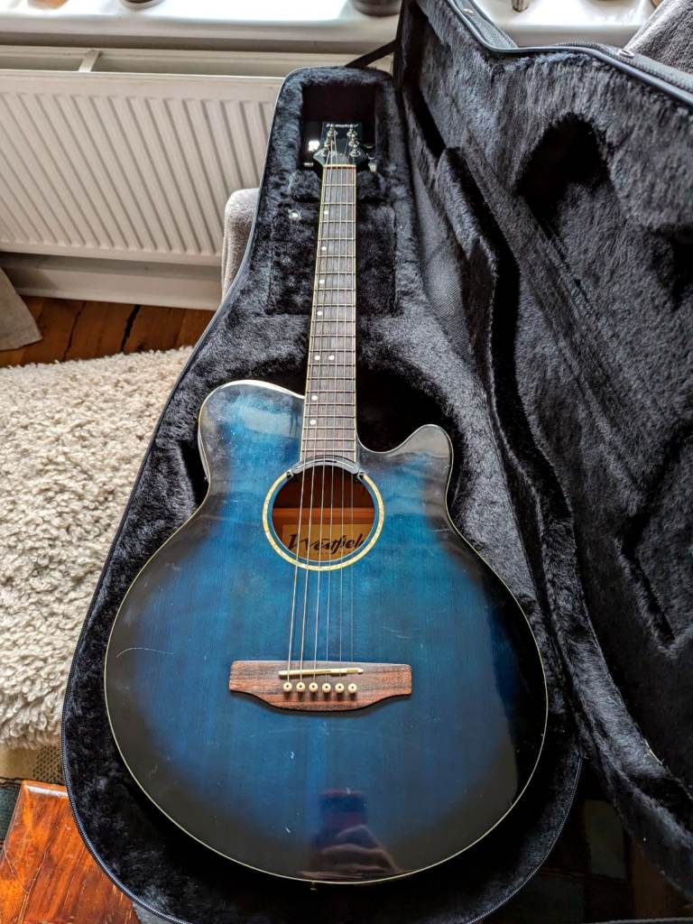 Blue acoustic guitar with built-in tuner, XLR output, preamp and magnetic pickup
