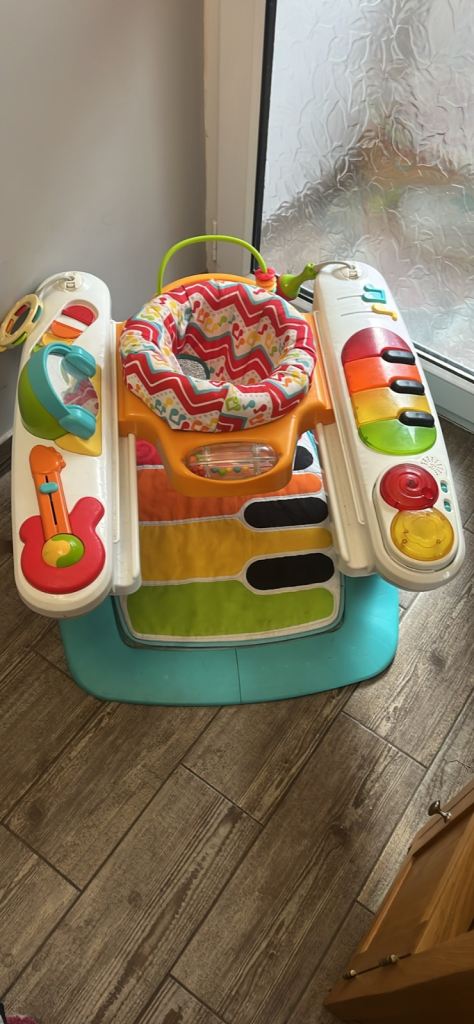 Baby walker with many more toys attached 