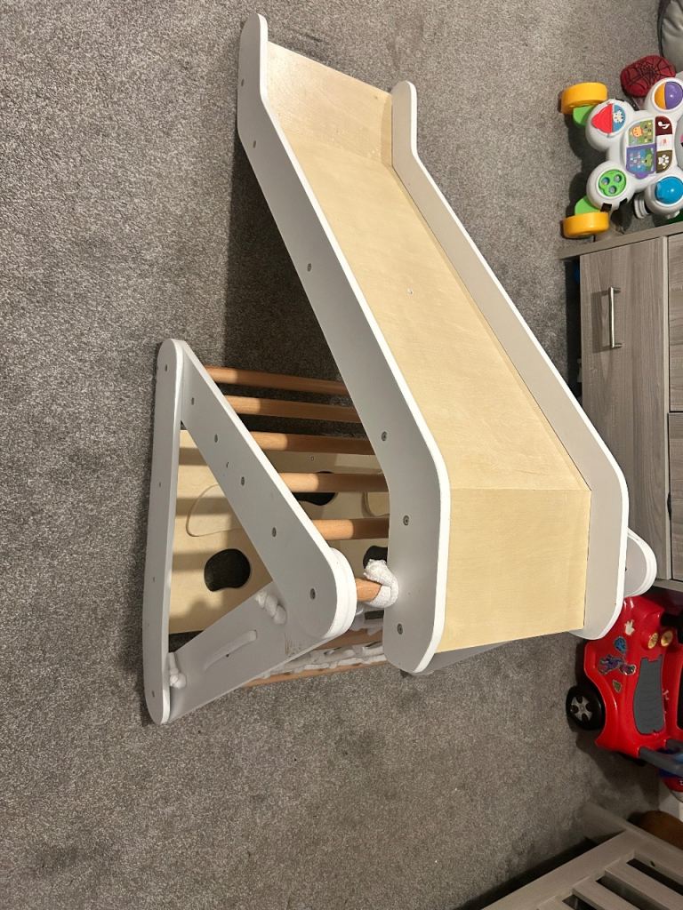 Wooden climbing frame with slide 