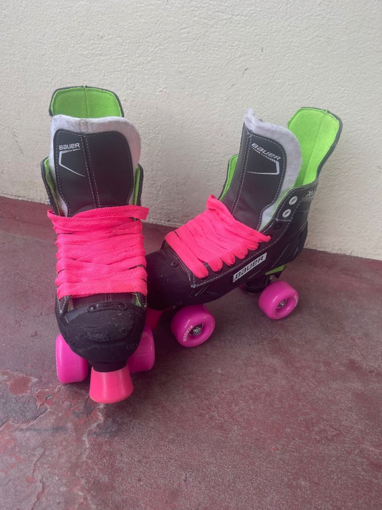 Bauer Quad Skates with Vibrant Pink Wheels and Laces
