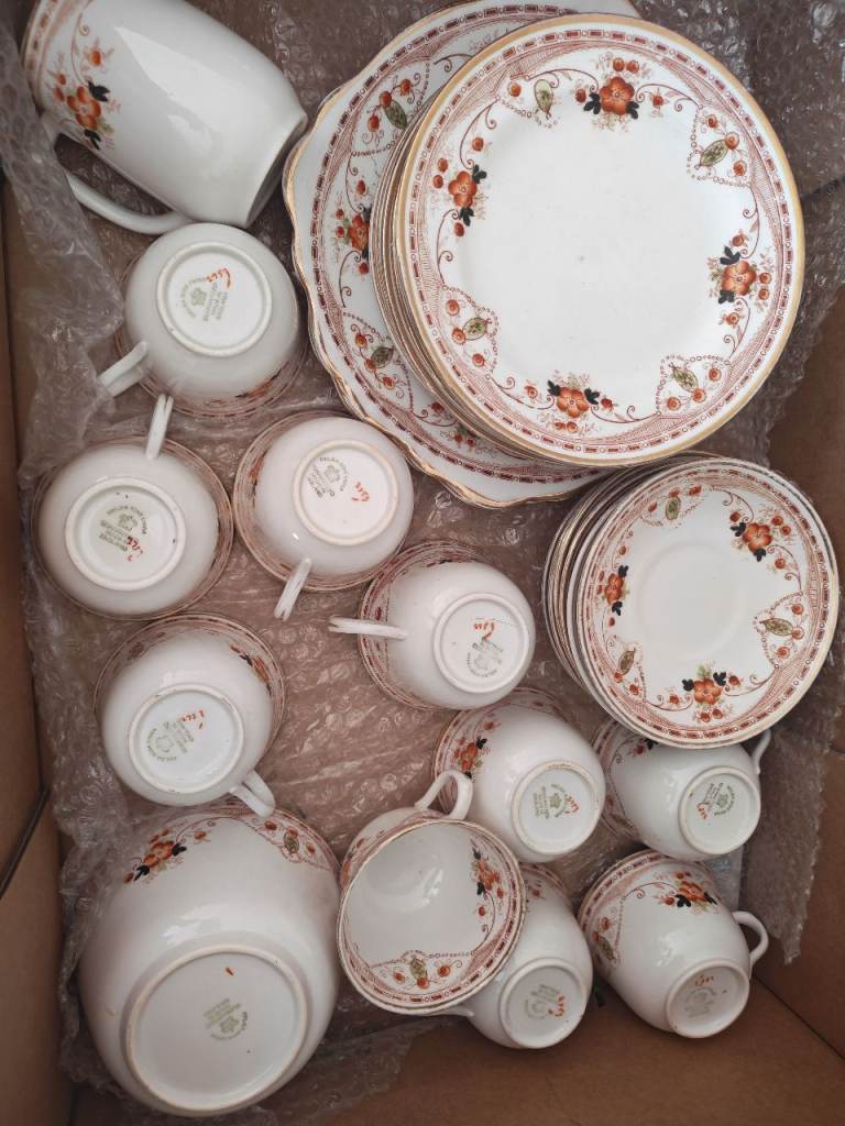 Melba Bone China, made in England.Design: Hand-painted or transfer-printed orange