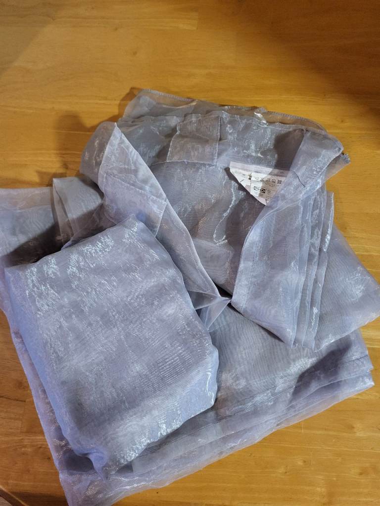 Pair of Ikea long silver/grey voile curtains.