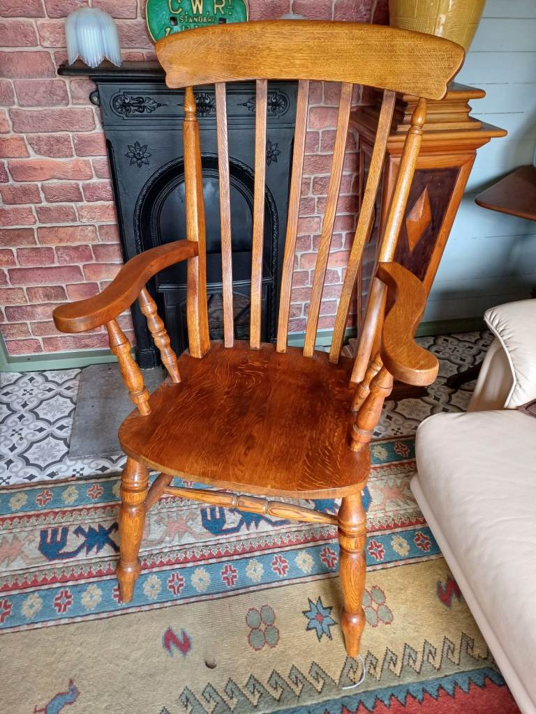 Windsor style solid oak armchair