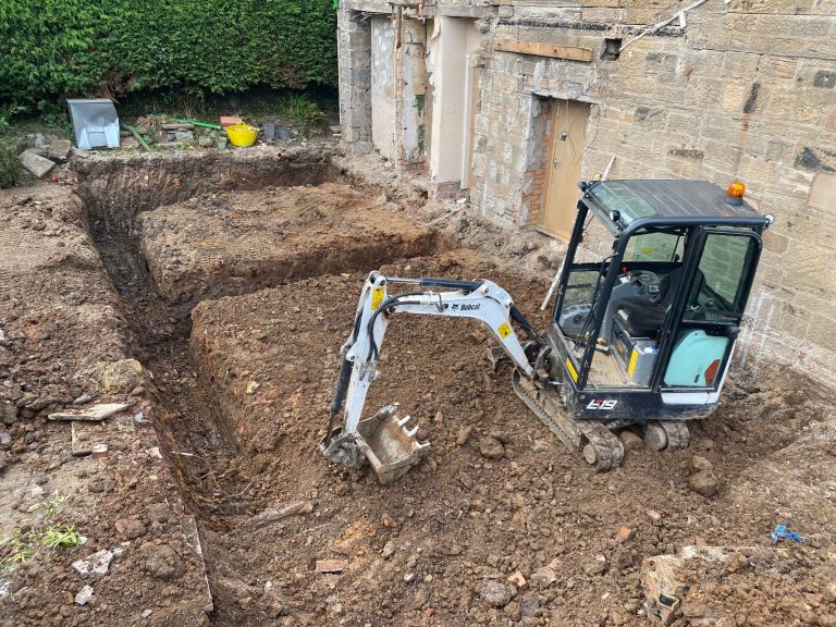 Mini digger hire with operator 