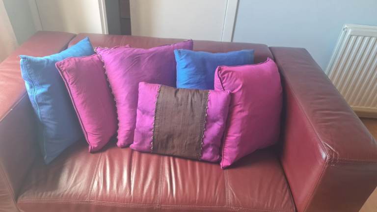 Feather-filled colourful throw pillows