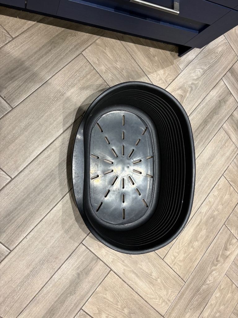 Medium plastic dog bed with thick cushion