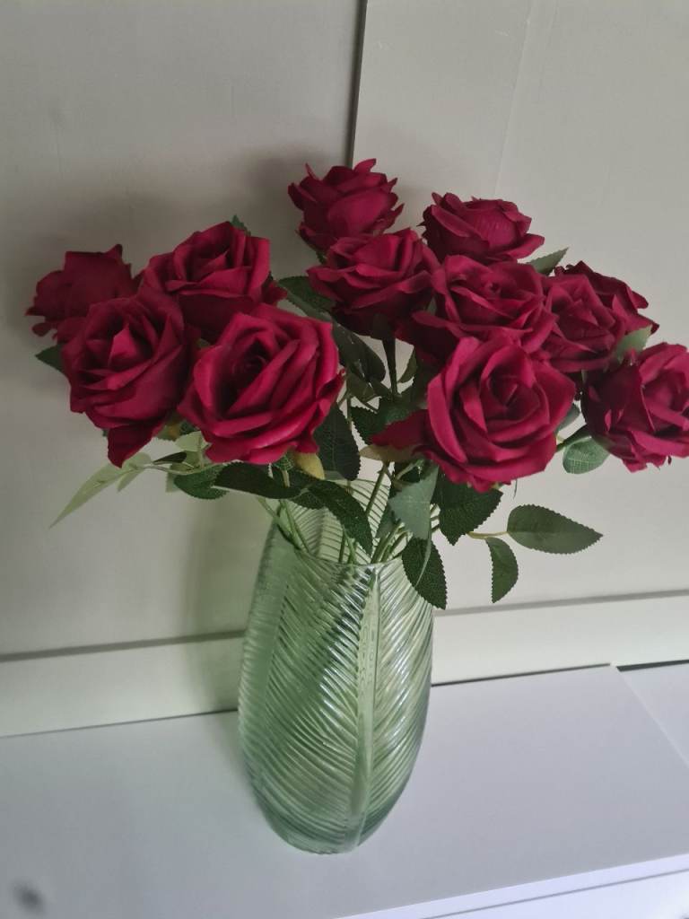 Large green vase with artifical rose spray 