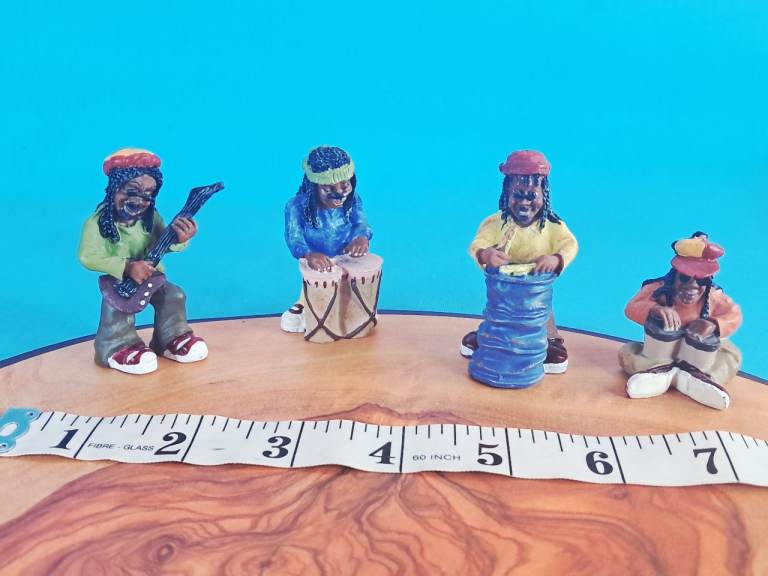 This i a set of vintage resin figurines depicting a Rastafarian reggae band. 