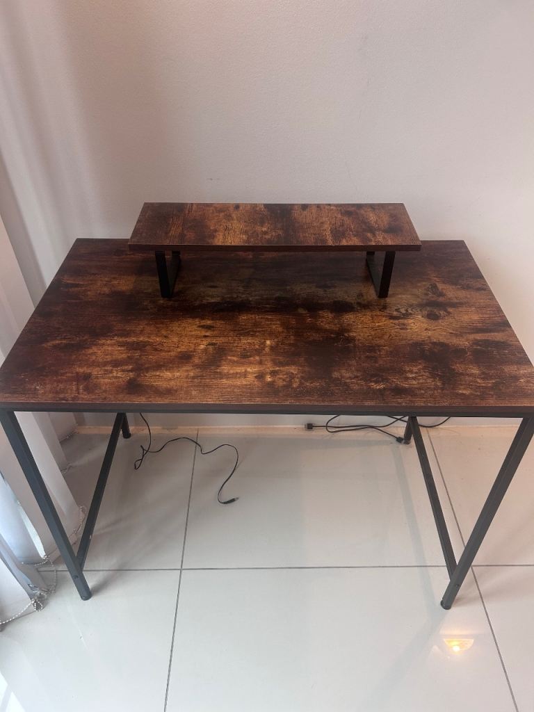 Standalone dark brown wooden desk with matching monitor stand
