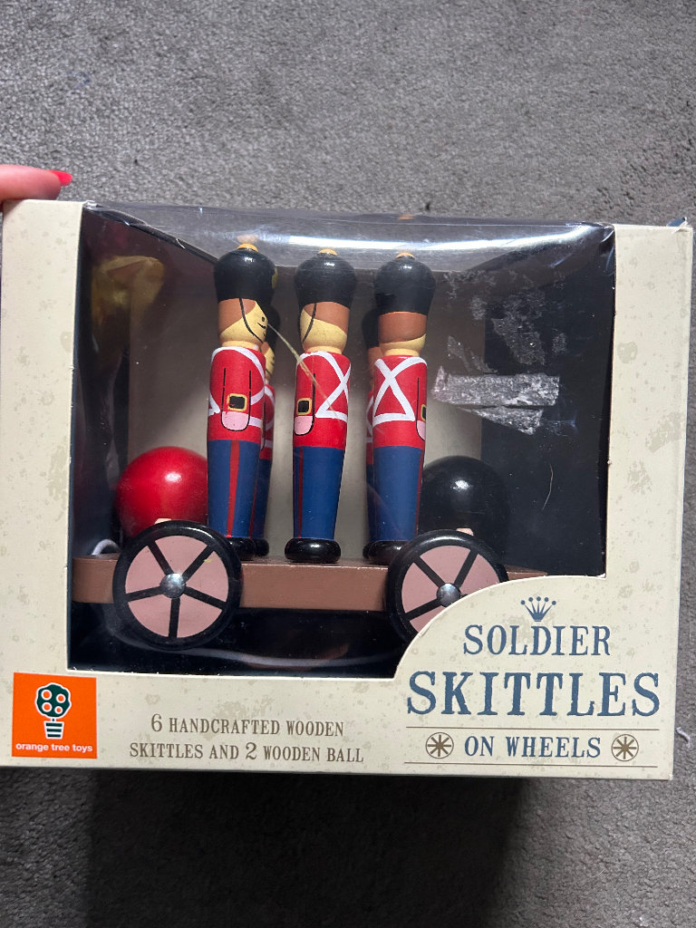 Handcrafted vintage wooden soldier skittles on wheels. 