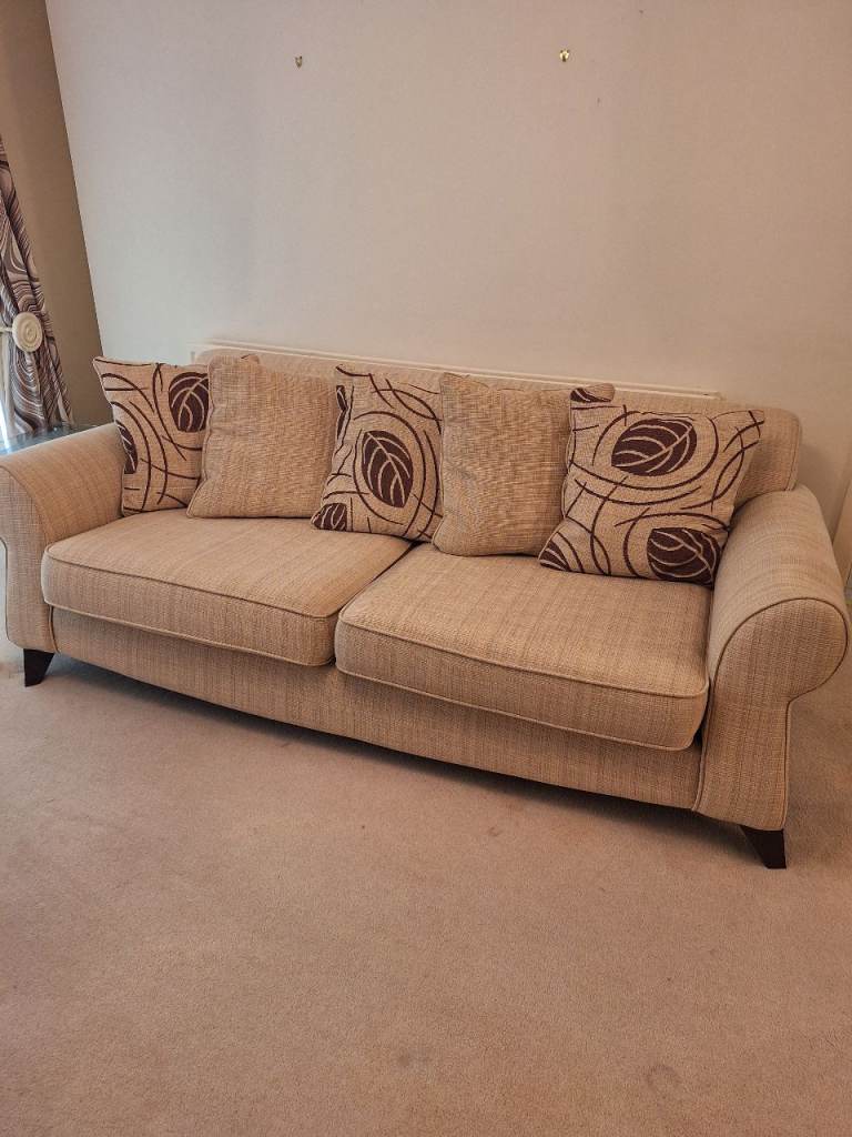 Lovely Beige Fabric Sofa with Patterned Cushions