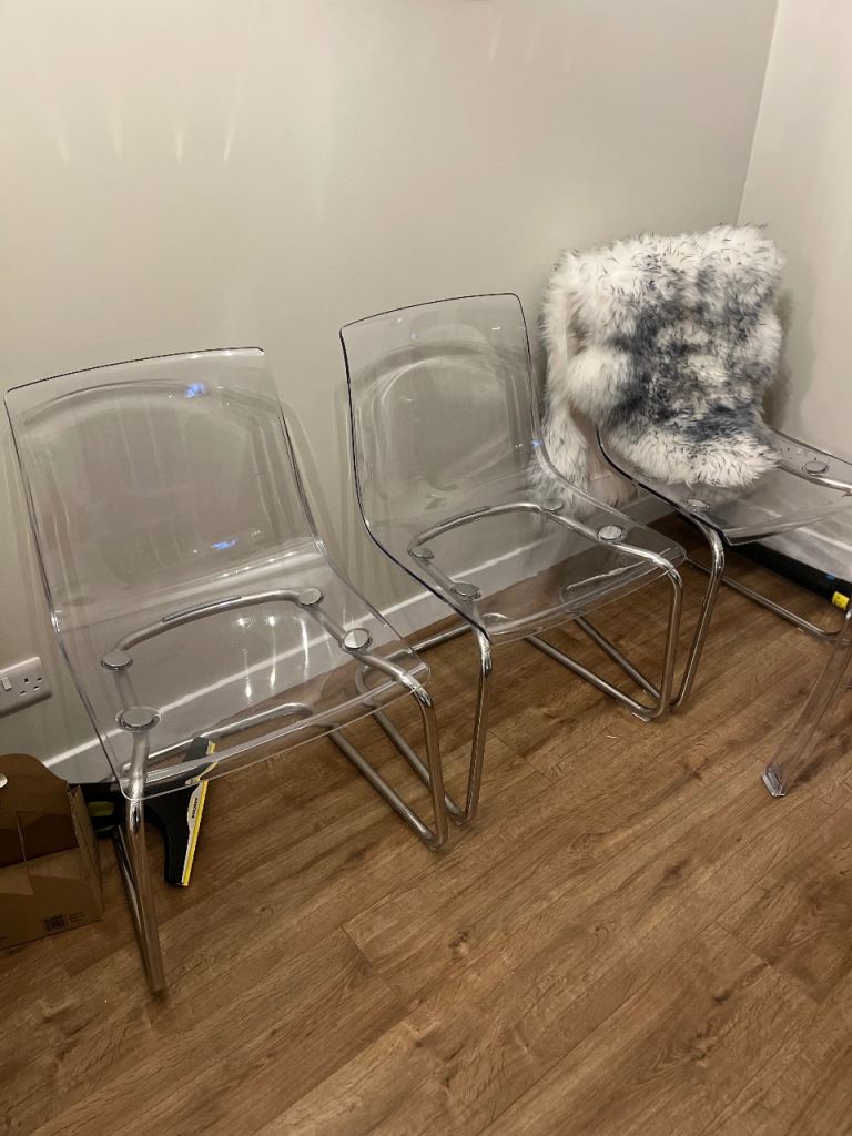 3 ikea chairs (chrome & clear plastic) plus two adjustable, swivel bar stools. 