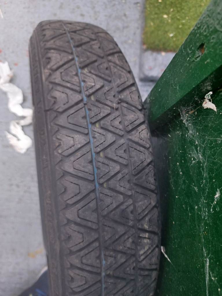 Car spare tyre and wheel.