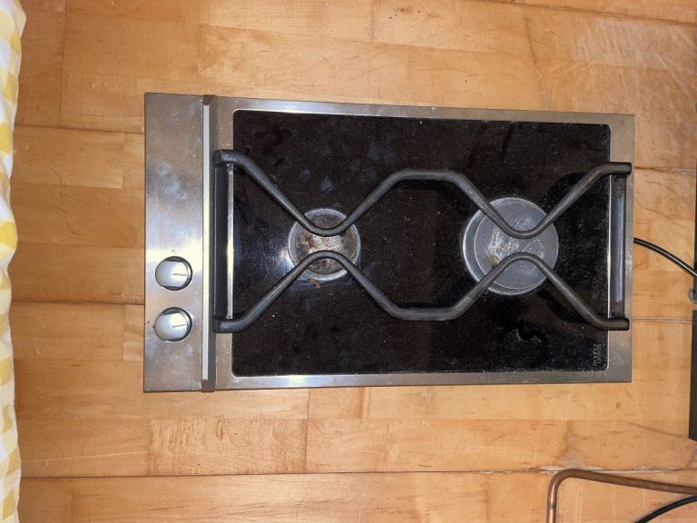 AEG double gas hob fittings included. 