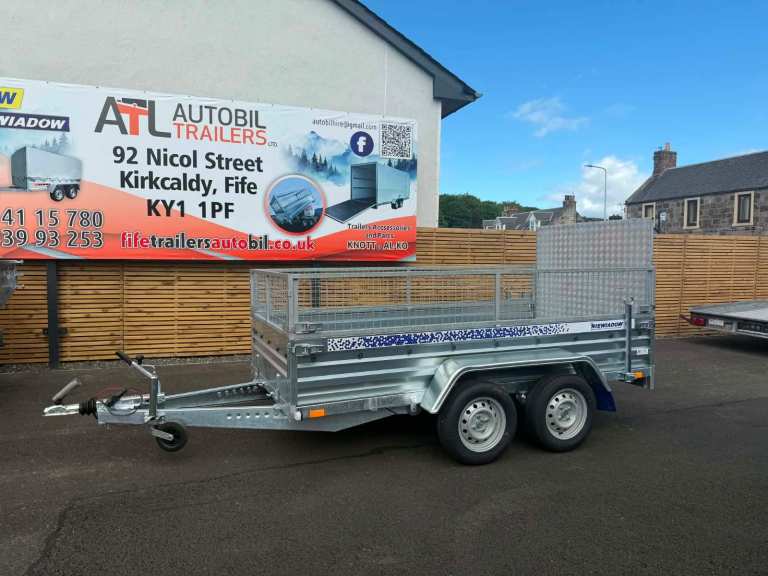 BRAND NEW 10FT X 5FT TWIN AXLE TRAILER WITH 40CM MESH AND RAMP 1300KG 