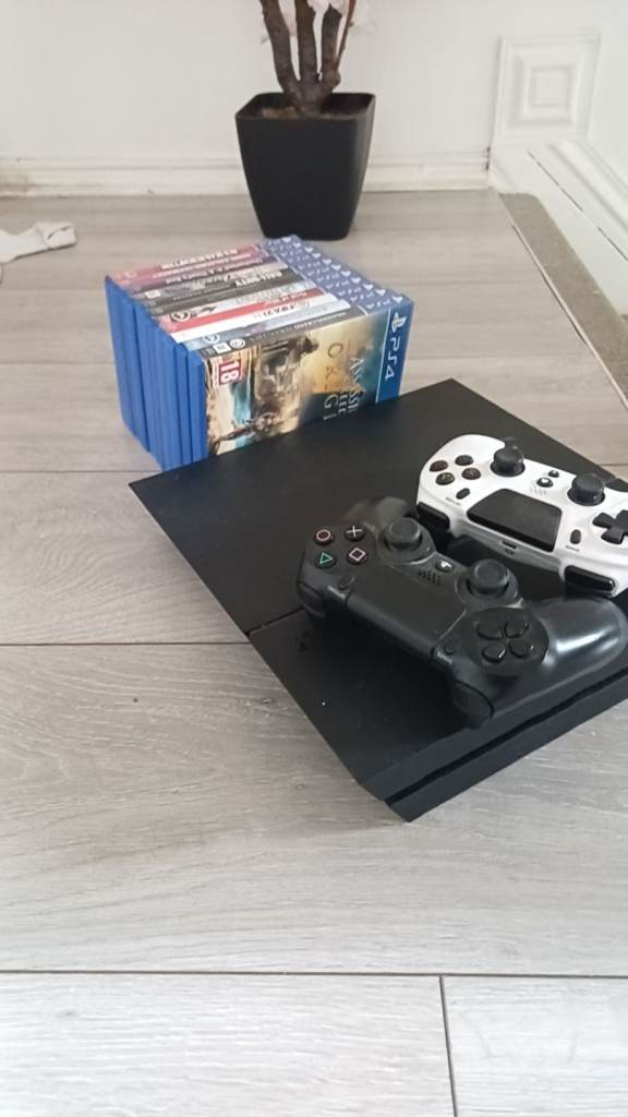 PS4 Console with Black and White Controllers