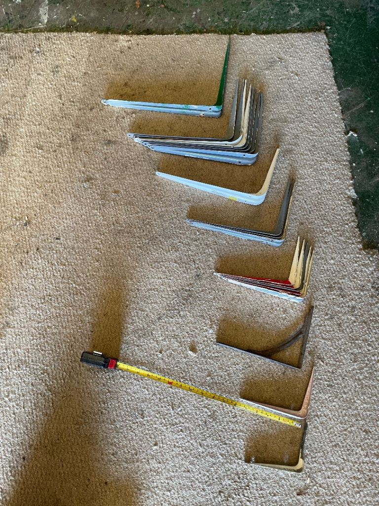 Job lot of 90 degree shelf brackets.