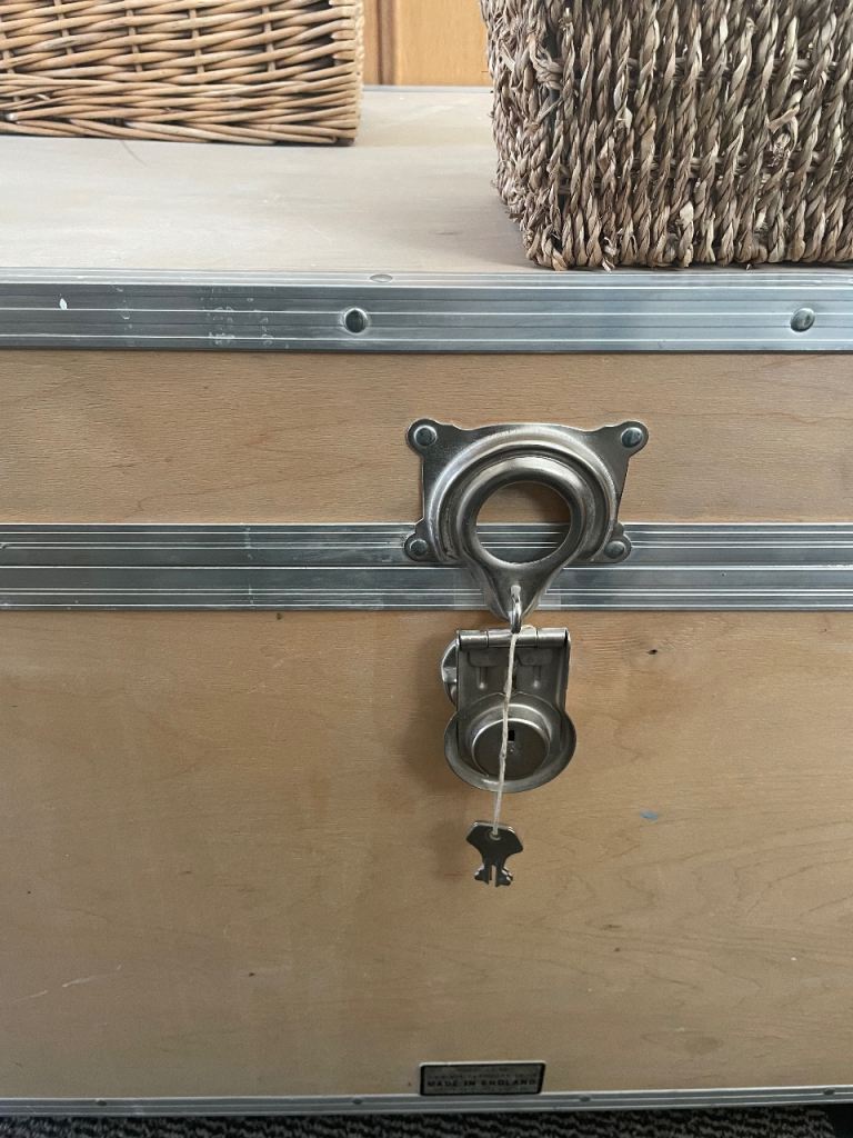 Large wooden light weight storage chest trunk with metal trim, handles, castors & 2 keys.