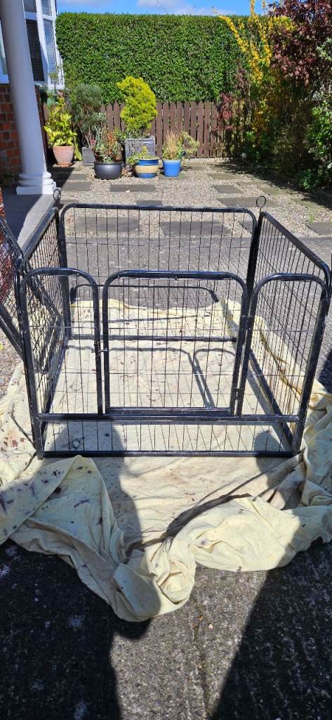 Puppy pen for sale.  Hardly used.  Black metal. Collapsible. 