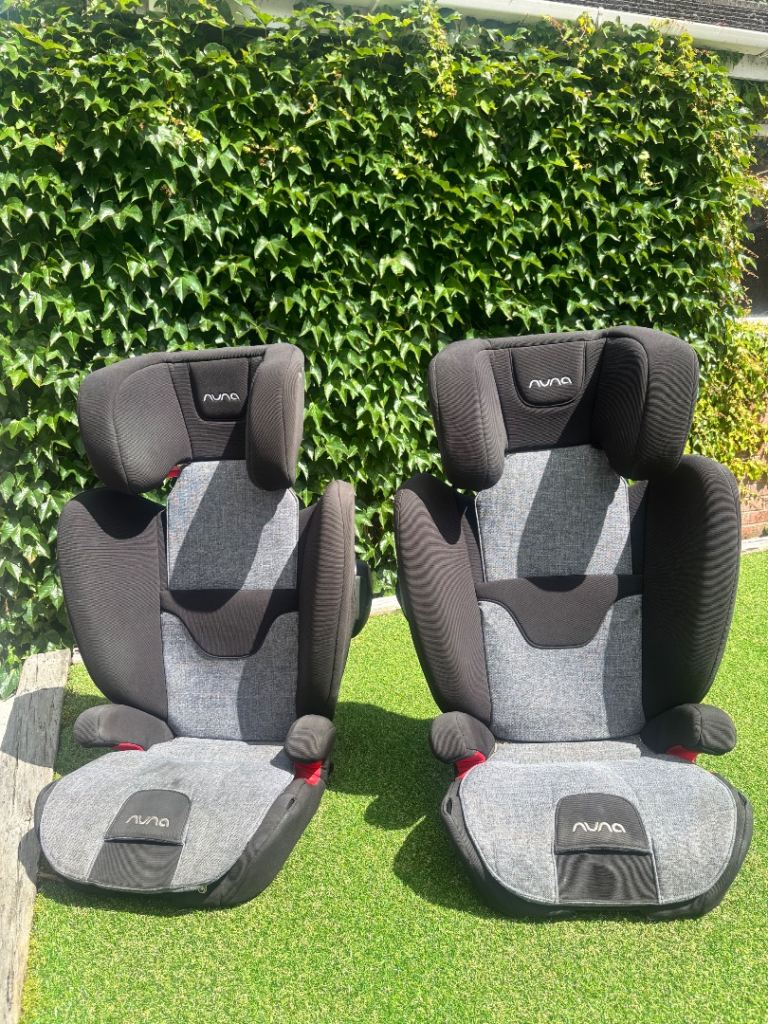 This Nuna AACE high back booster car seat features a charcoal and grey tweed fabric design