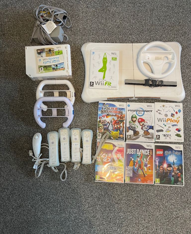 Nintendo Wii with controllers, games and board