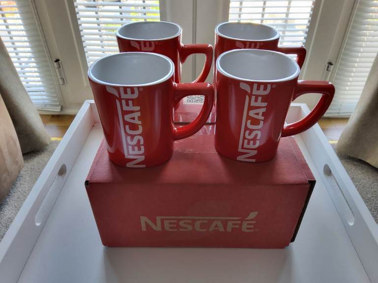 A set of 4 brand new Nescafe themed coffee mugs
