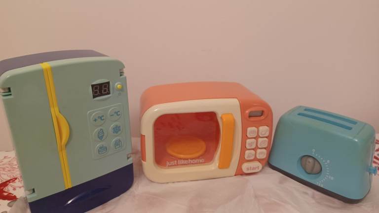mini refrigerator, a microwave, and a toaster