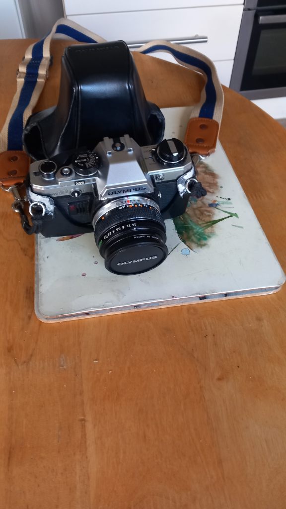 Olympus OM-10 35mm Camera with Lens and Case – Good Condition
