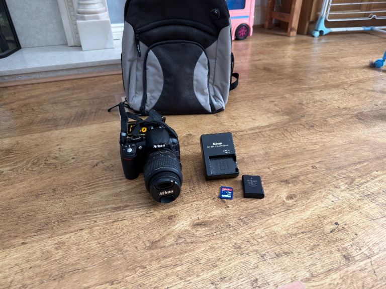 Nikon D3100 DSLR Camera With Bag