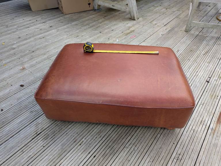 Tan leather ottoman / pouffe