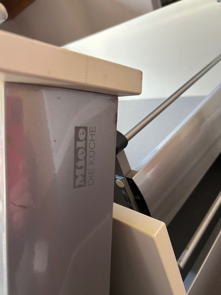 3 Miele kitchen drawers cream with brushed steel handles