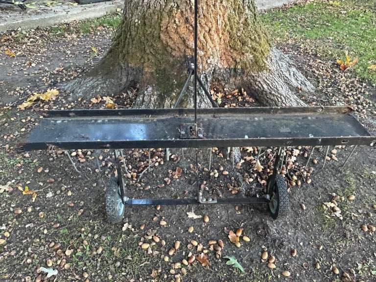 Ride on mower lawn aerator/scarifier