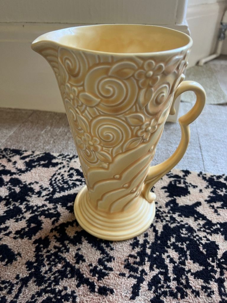 Yellow Wade Art Deco jug with a floral relief pattern