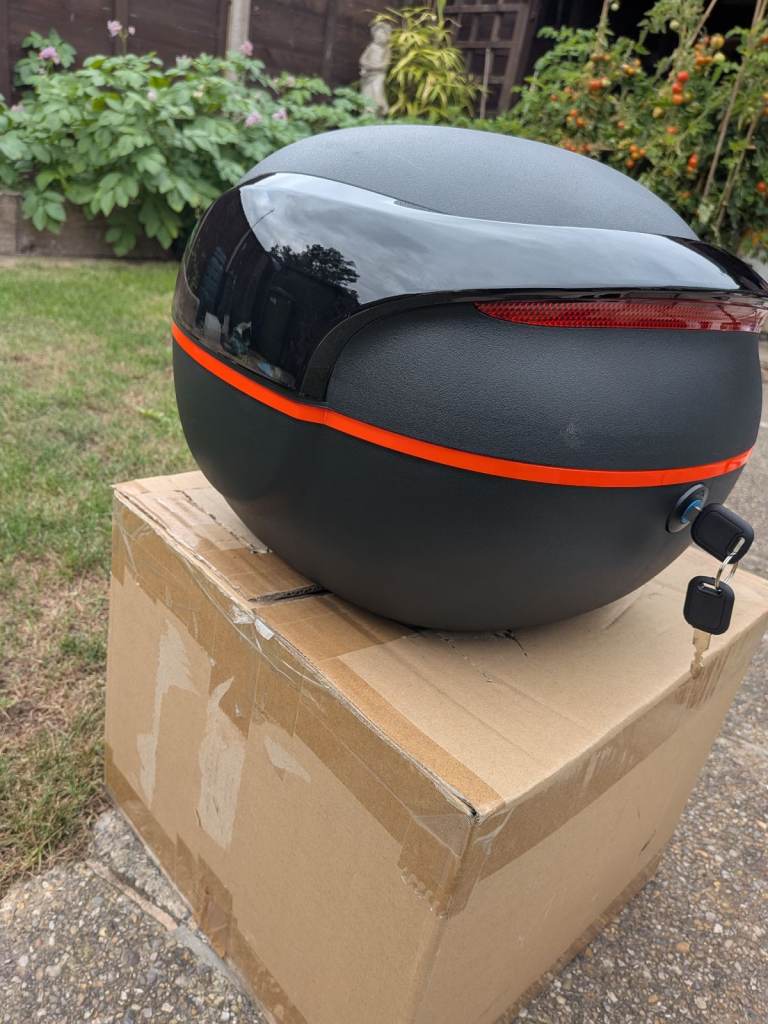 Brand new unbranded motorcycle top box with mounting fittings and key