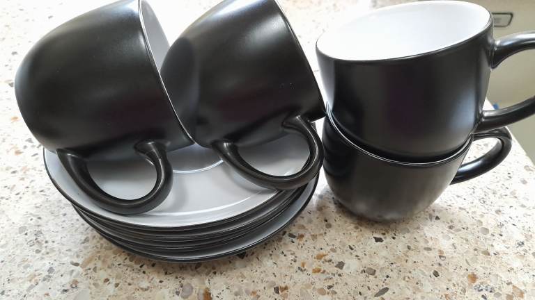 Black and white coffee cups and saucers x 4