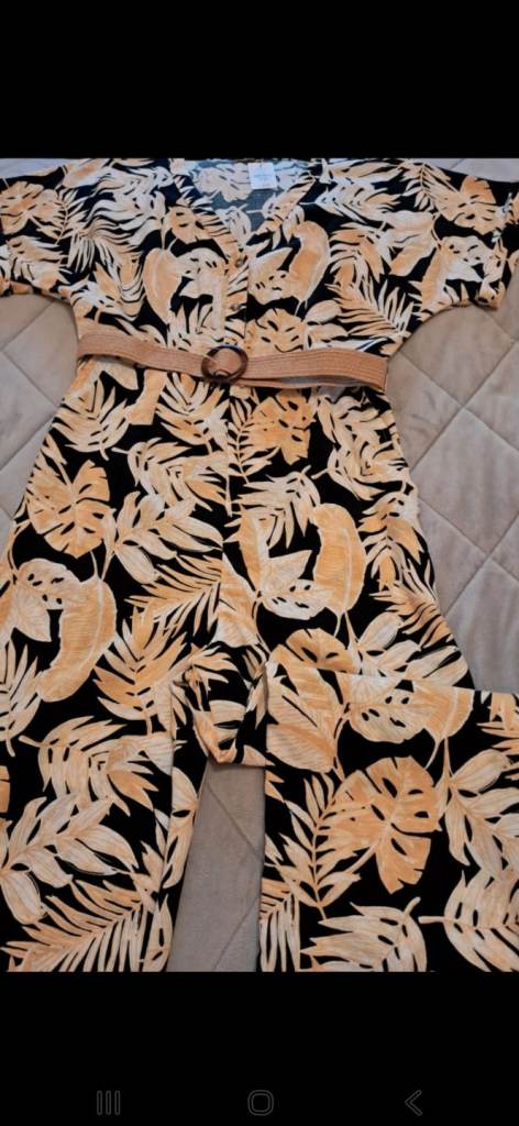 Ladies wide leg jumpsuit.  Size 10 but will fit bigger