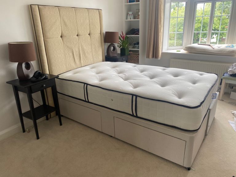 Small double bed with mattress and headboard