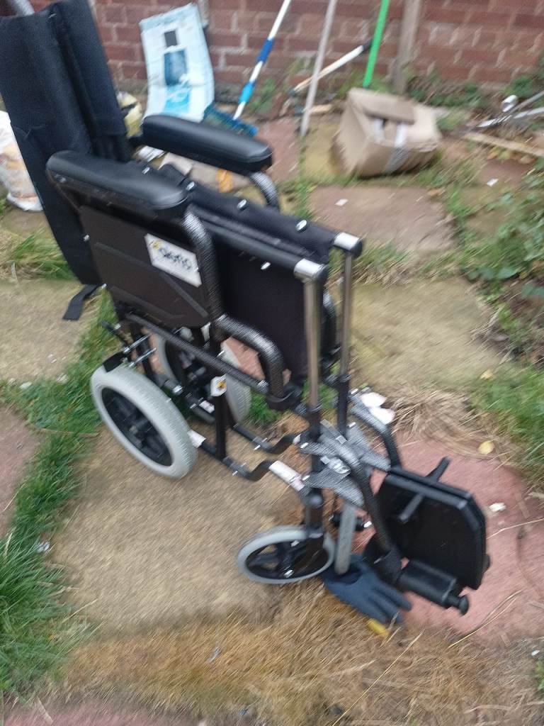 Folding Wheelchair in excellent condition with Padded Backrest and Seat can deliver 