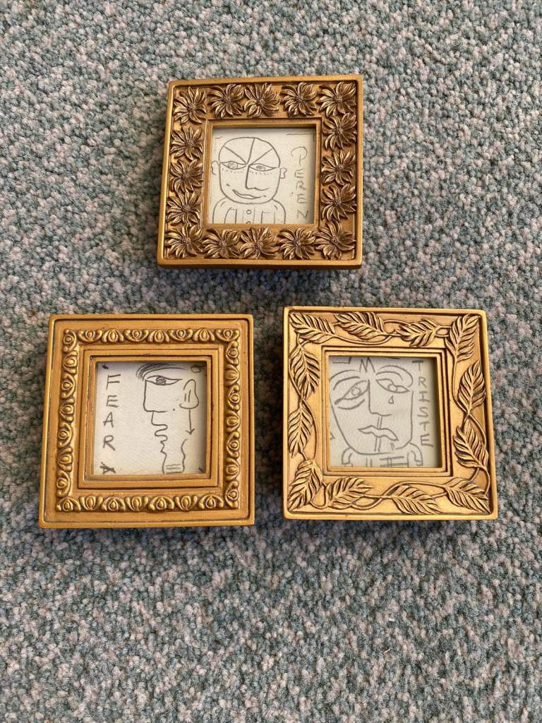 Original pencil drawings in small gold frames