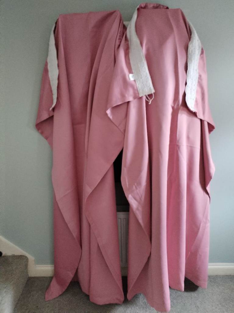 Pair of pink black out curtains 