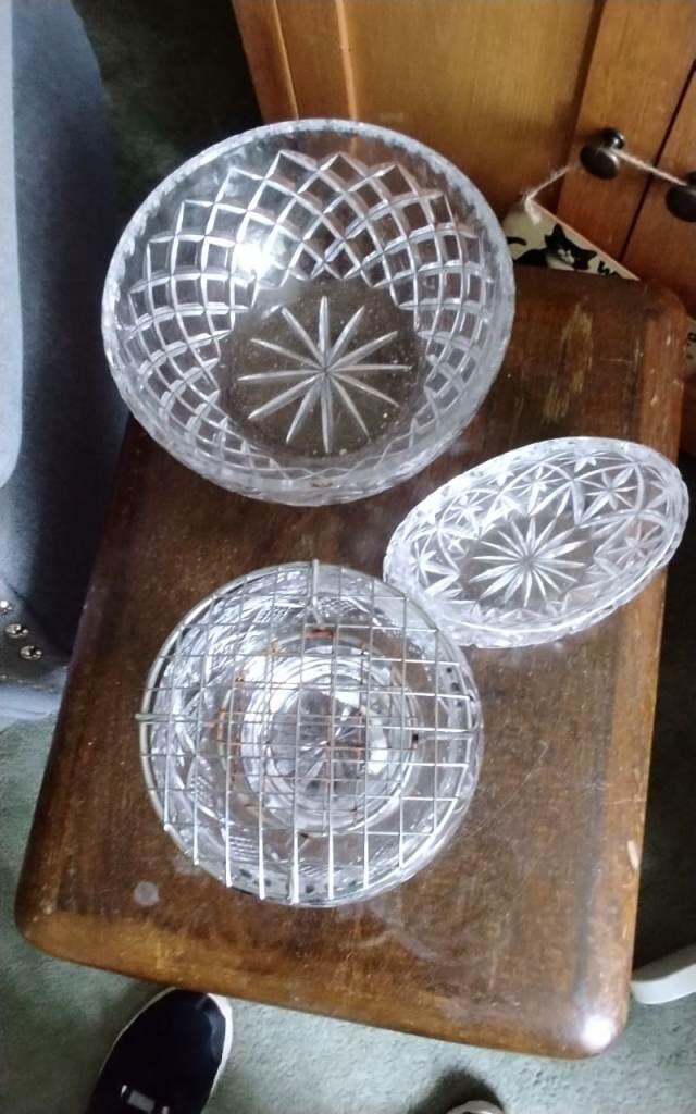 Set of cut glass bowls with intricate patterns.