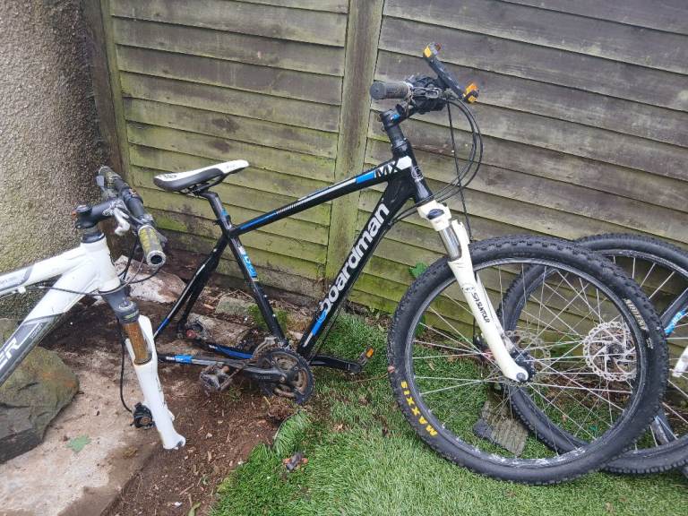 Two mountain bikes  and workshop stand and 3 bike transporter 