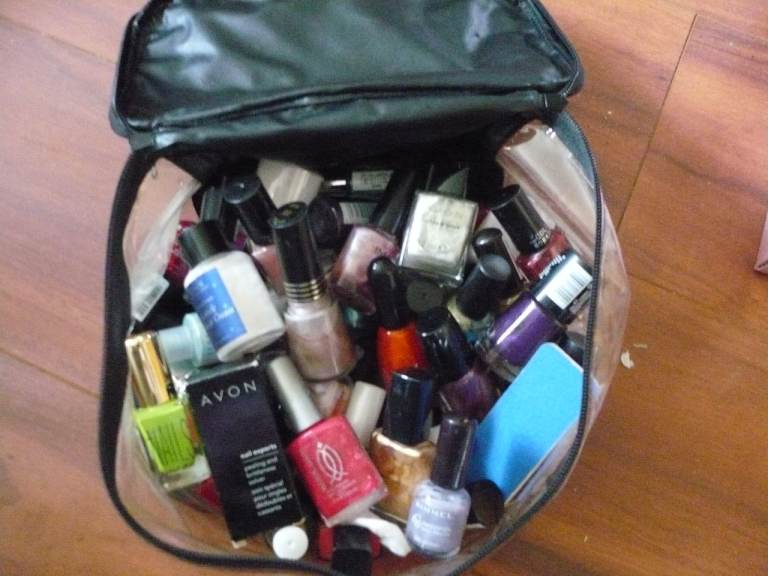 Large Collection of Nail Polishes in Bag