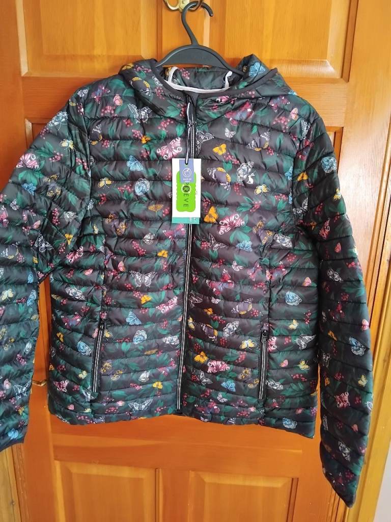Puffer jacket with butterfly design, has a hood